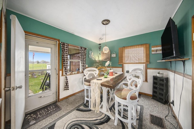 317 E Argyle St, Jackson, MI 49202 - carpeted dining room featuring baseboards and ornamental molding
