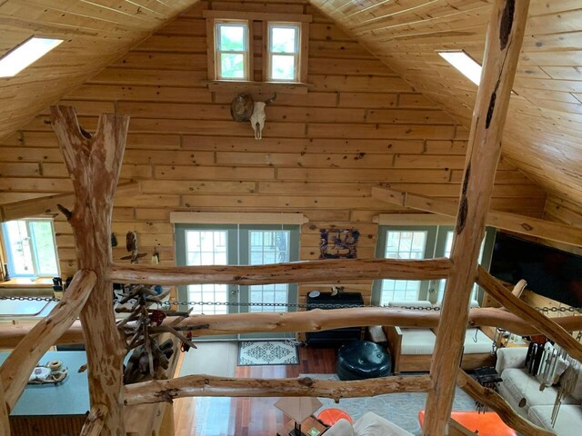 5093 E County Line Rd, Michigan, MI 49411 - living area with wood ceiling, wood walls, wood finished floors, and high vaulted ceiling
