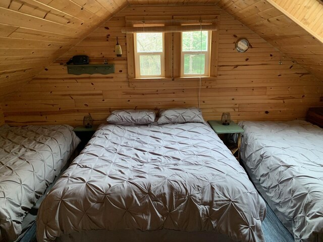 5093 E County Line Rd, Michigan, MI 49411 - bedroom with wood walls, vaulted ceiling, wood ceiling, and carpet flooring