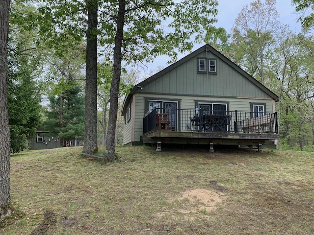 5093 E County Line Rd, Michigan, MI 49411 - view of front of property featuring a wooden deck and a front lawn