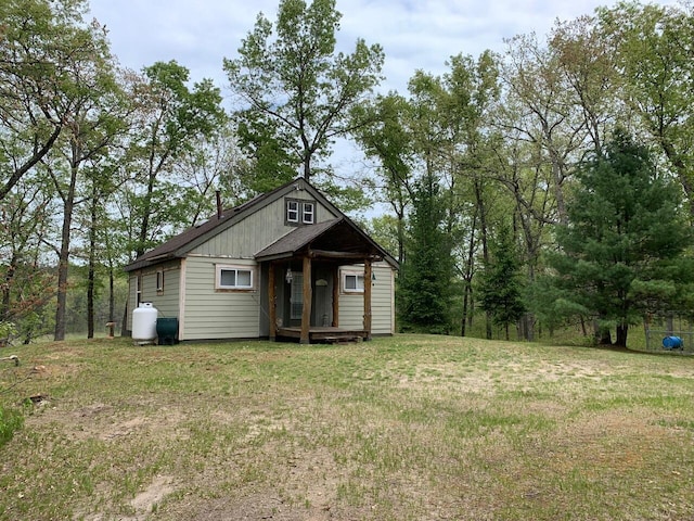 5093 E County Line Rd, Michigan, MI 49411 - bungalow-style house with a front lawn