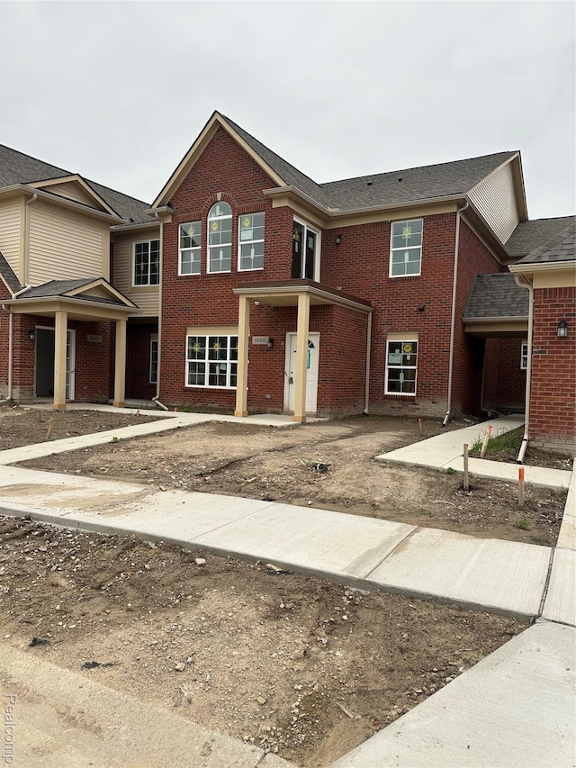 48504 Bridge Way Unit 562, Canton, MI 48188 - traditional-style house with brick siding