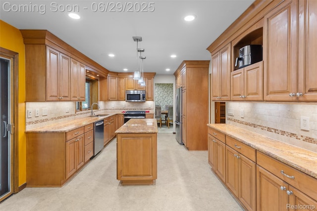 1304 Player Dr, Troy, MI 48085 - kitchen with stainless steel appliances, light stone counters, a kitchen island, tasteful backsplash, and decorative light fixtures