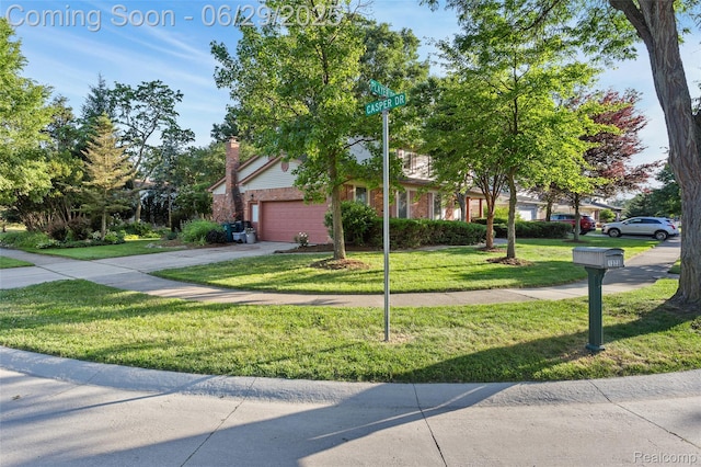 1304 Player Dr, Troy, MI 48085 - view of property hidden behind natural elements featuring a front lawn, a garage, brick siding, and driveway