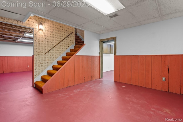 1304 Player Dr, Troy, MI 48085 - finished basement with a wainscoted wall, stairway, wood walls, and a drop ceiling