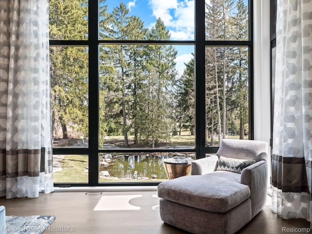 4890 Charing Cross Rd, Bloomfield Hills, MI 48304 - sitting room featuring healthy amount of natural light, floor to ceiling windows, and wood finished floors