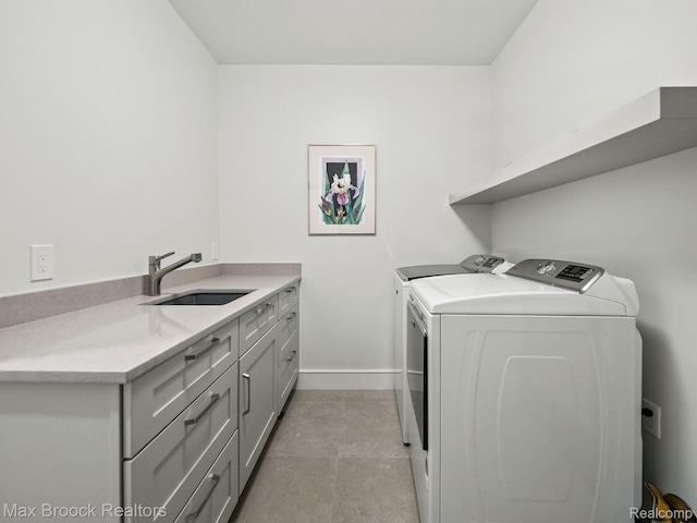 4890 Charing Cross Rd, Bloomfield Hills, MI 48304 - laundry room with cabinet space, independent washer and dryer, and light tile patterned floors