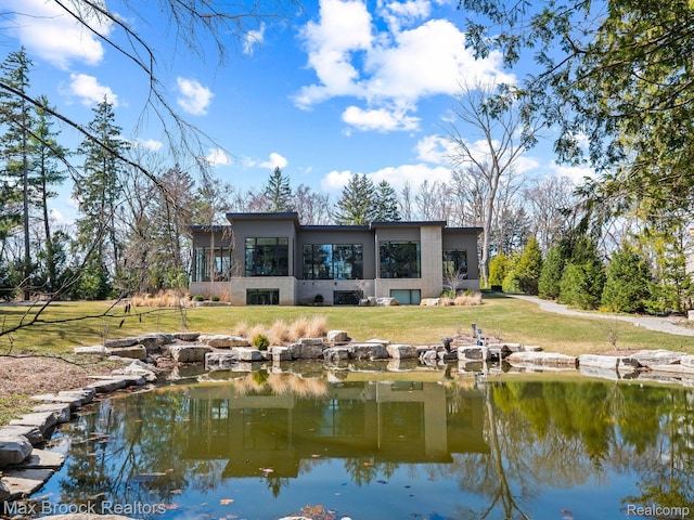 4890 Charing Cross Rd, Bloomfield Hills, MI 48304 - rear view of property featuring a sunroom, a yard, and stucco siding