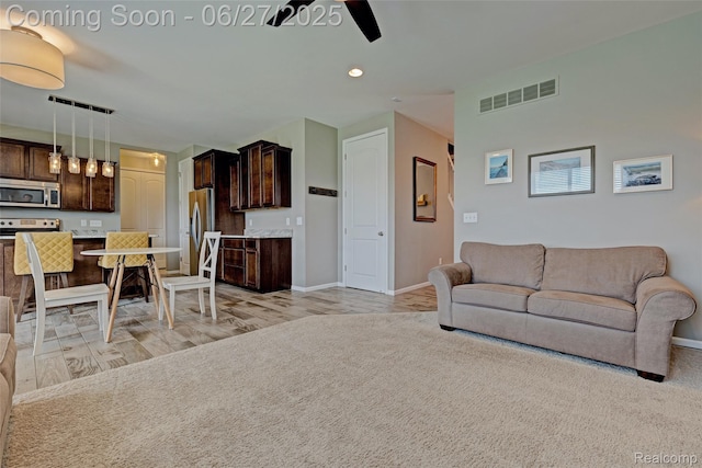 28545 Cottage Ln, New Hudson, MI 48165 - living room with a ceiling fan, recessed lighting, and light wood-style floors
