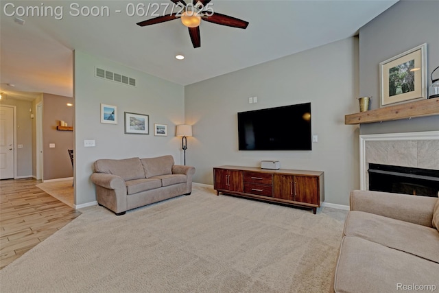 28545 Cottage Ln, New Hudson, MI 48165 - carpeted living area featuring a ceiling fan, recessed lighting, and a tile fireplace