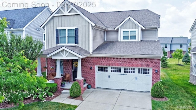 28545 Cottage Ln, New Hudson, MI 48165 - craftsman inspired home featuring board and batten siding, a front lawn, brick siding, and concrete driveway