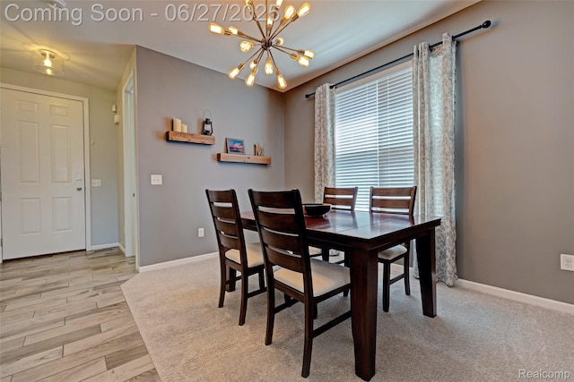 28545 Cottage Ln, New Hudson, MI 48165 - dining space featuring a chandelier and light wood-type flooring