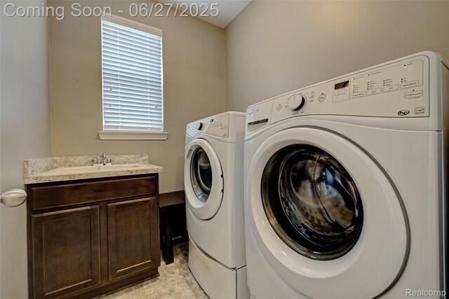 28545 Cottage Ln, New Hudson, MI 48165 - laundry room featuring independent washer and dryer and cabinet space
