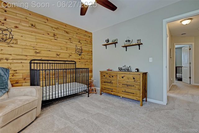 28545 Cottage Ln, New Hudson, MI 48165 - carpeted bedroom featuring wooden walls and a ceiling fan