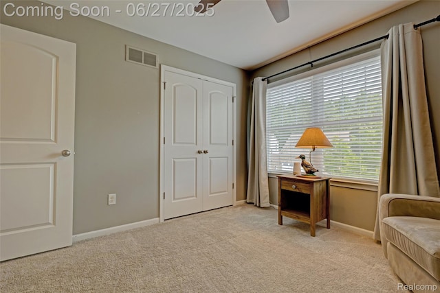 28545 Cottage Ln, New Hudson, MI 48165 - living area featuring light colored carpet and a ceiling fan