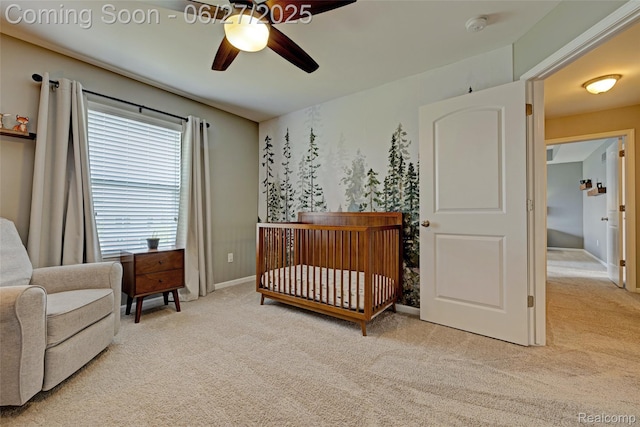 28545 Cottage Ln, New Hudson, MI 48165 - carpeted bedroom featuring a crib and a ceiling fan