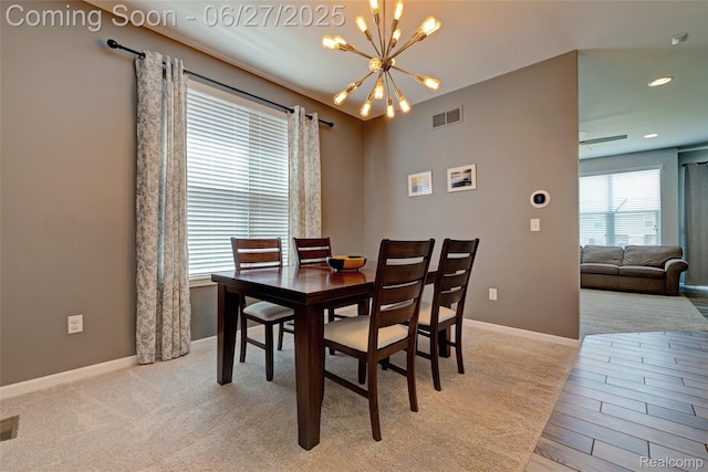 28545 Cottage Ln, New Hudson, MI 48165 - dining area with a chandelier and light colored carpet