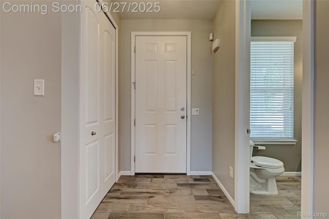 28545 Cottage Ln, New Hudson, MI 48165 - hall with wood finished floors and baseboards