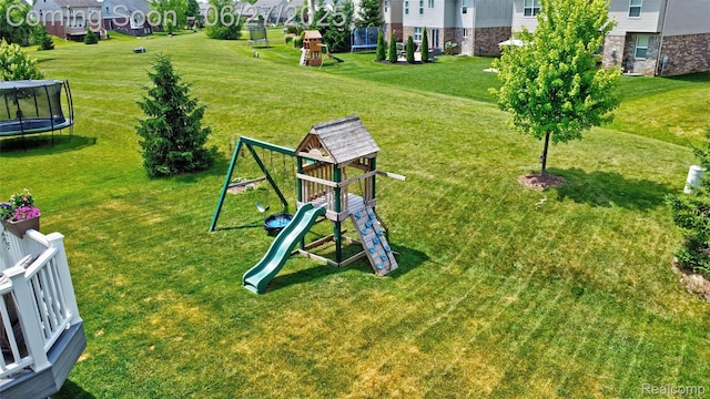 28545 Cottage Ln, New Hudson, MI 48165 - view of community with a trampoline, a playground, a yard, and a residential view