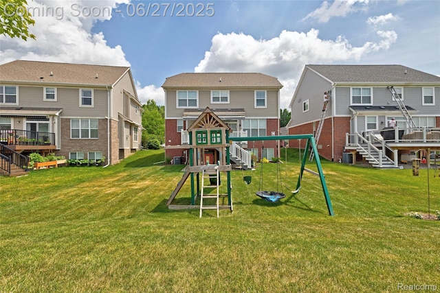 28545 Cottage Ln, New Hudson, MI 48165 - view of play area featuring a yard, stairs, and a wooden deck