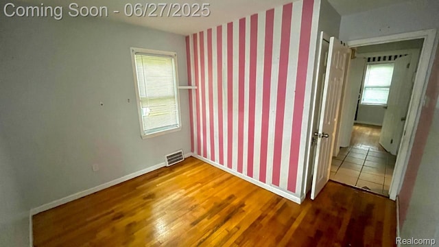 12857 Robson St, Detroit, MI 48227 - unfurnished room with wood finished floors and wallpapered walls
