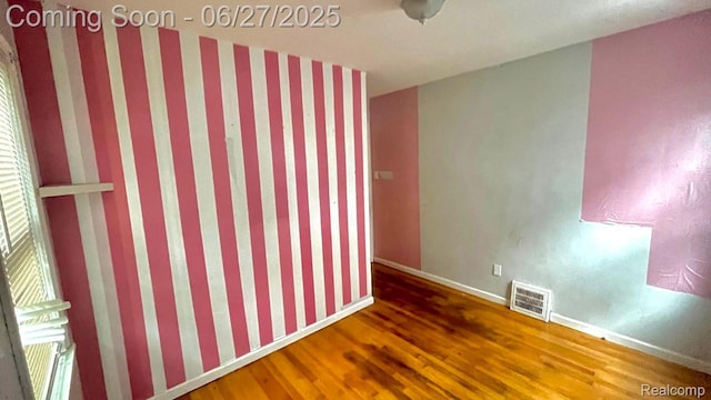 12857 Robson St, Detroit, MI 48227 - unfurnished room featuring wood finished floors and baseboards