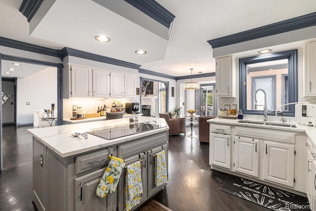 50530 Hunters Creek Trl, Shelby Twp, MI 48317 - kitchen featuring black electric stovetop, crown molding, white cabinetry, dark wood-type flooring, and recessed lighting