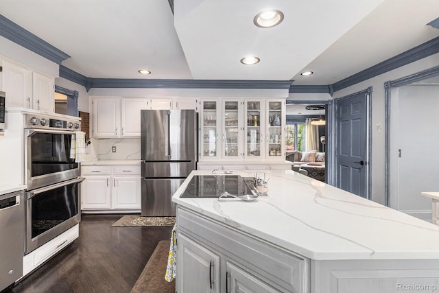 50530 Hunters Creek Trl, Shelby Twp, MI 48317 - kitchen with appliances with stainless steel finishes, crown molding, a center island, white cabinetry, and dark wood-style floors