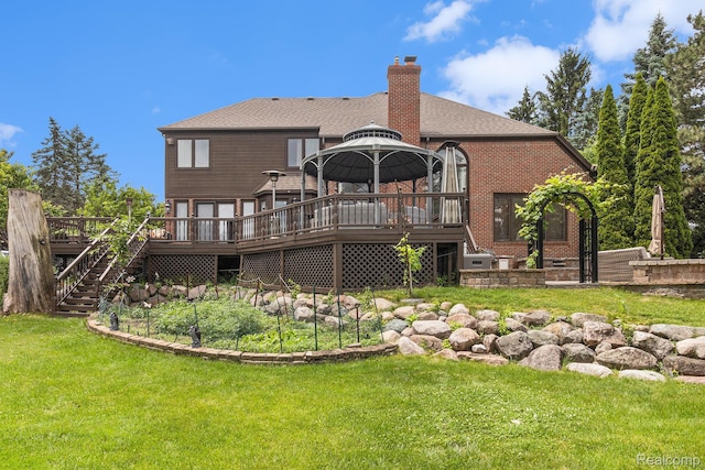 50530 Hunters Creek Trl, Shelby Twp, MI 48317 - back of house with a gazebo, stairs, a wooden deck, brick siding, and a lawn