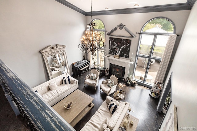 50530 Hunters Creek Trl, Shelby Twp, MI 48317 - living area featuring a chandelier, wood finished floors, crown molding, and a high end fireplace