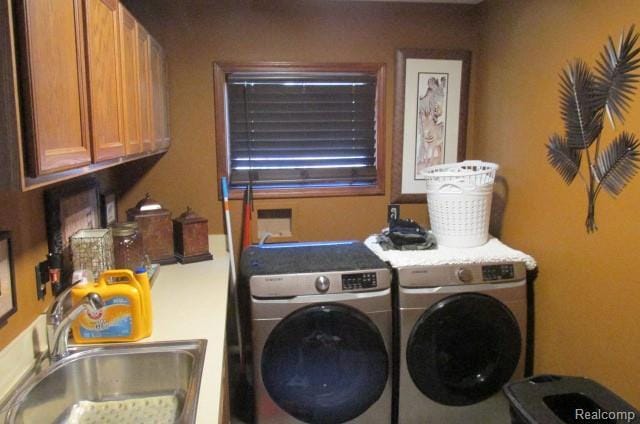43870 Boulder Dr, Clinton Township, MI 48038 - washroom featuring cabinet space and washer and dryer
