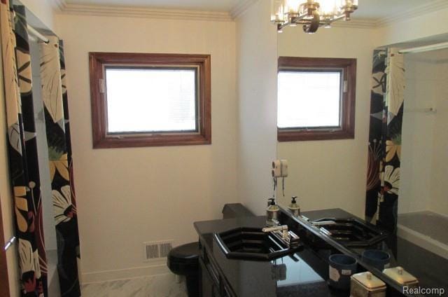 43870 Boulder Dr, Clinton Township, MI 48038 - full bath featuring a chandelier, healthy amount of natural light, a shower with shower curtain, vanity, and crown molding
