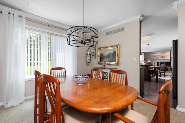 7662 Hidden Ponds Blvd, Brighton, MI 48114 - dining room featuring a chandelier, dark colored carpet, and crown molding