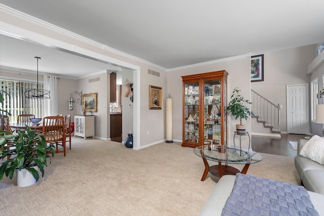 7662 Hidden Ponds Blvd, Brighton, MI 48114 - living room with stairway, crown molding, carpet floors, and a chandelier