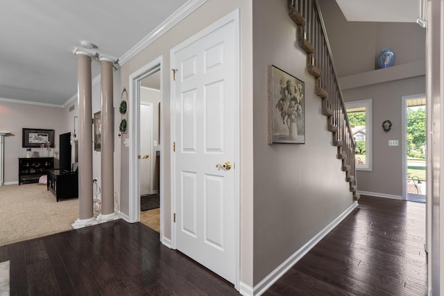 7662 Hidden Ponds Blvd, Brighton, MI 48114 - hall featuring ornate columns, dark wood-style flooring, ornamental molding, and stairs