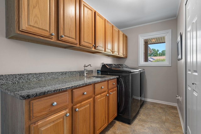 7662 Hidden Ponds Blvd, Brighton, MI 48114 - laundry room featuring cabinet space, washer and clothes dryer, and crown molding