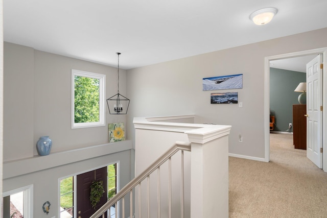 7662 Hidden Ponds Blvd, Brighton, MI 48114 - corridor featuring an upstairs landing and light colored carpet