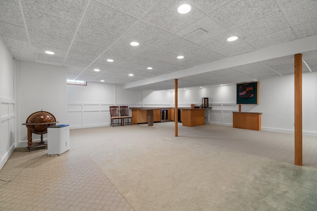 7662 Hidden Ponds Blvd, Brighton, MI 48114 - finished below grade area with carpet flooring, recessed lighting, a decorative wall, and a drop ceiling