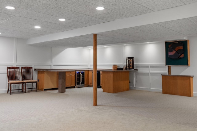 7662 Hidden Ponds Blvd, Brighton, MI 48114 - finished below grade area featuring a decorative wall, beverage cooler, bar area, light carpet, and recessed lighting