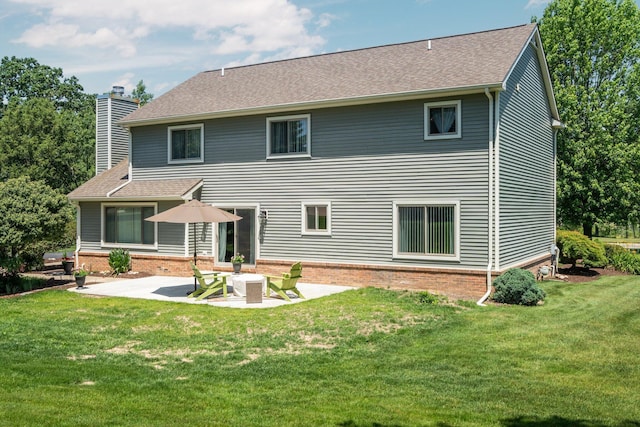 7662 Hidden Ponds Blvd, Brighton, MI 48114 - rear view of house with a chimney, a patio area, a lawn, and roof with shingles