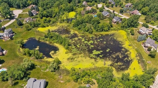 7662 Hidden Ponds Blvd, Brighton, MI 48114 - aerial view of residential area with a nearby body of water
