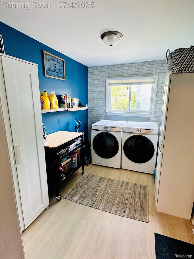 23360 Battelle Ave, Hazel Park, MI 48030 - laundry room featuring washing machine and clothes dryer and wood finished floors