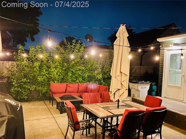 23360 Battelle Ave, Hazel Park, MI 48030 - patio at twilight with a patio area, an outdoor living space with a fire pit, and outdoor dining area