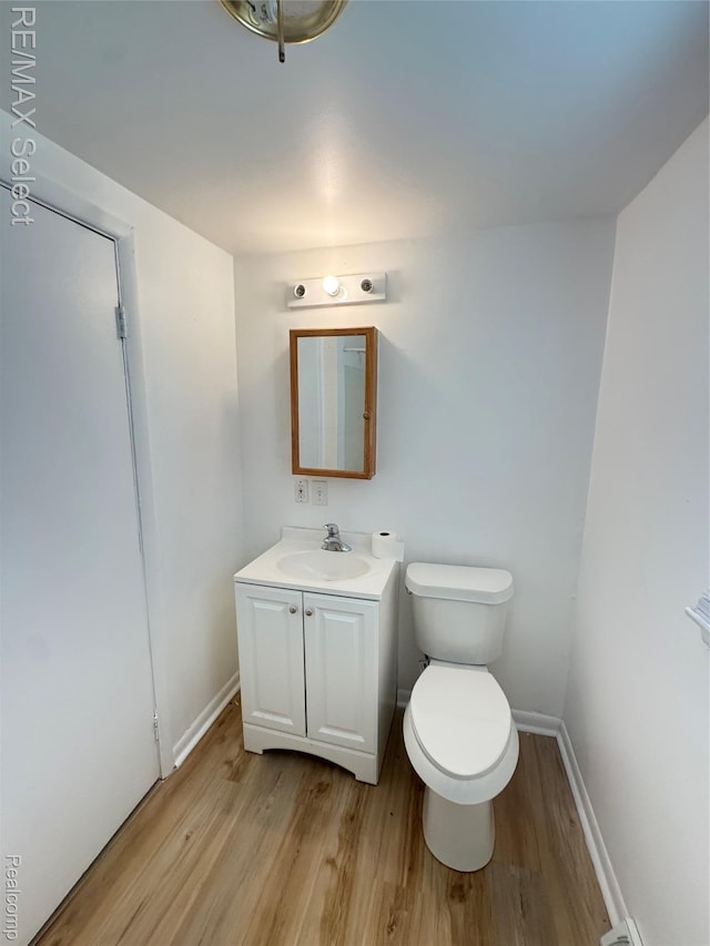 2017 Noble Ave, Flushing, MI 48532 - half bathroom with wood finished floors and vanity