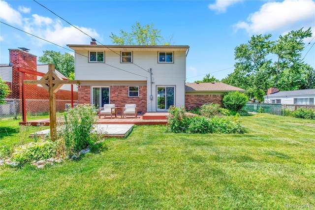 607 Ashburnham St, Auburn Hills, MI 48326 - rear view of property featuring a deck and brick siding