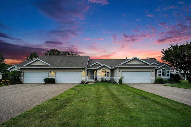 1721 Quail Run Dr, Kalamazoo, MI 49009 - ranch-style house featuring driveway, a garage, and a yard