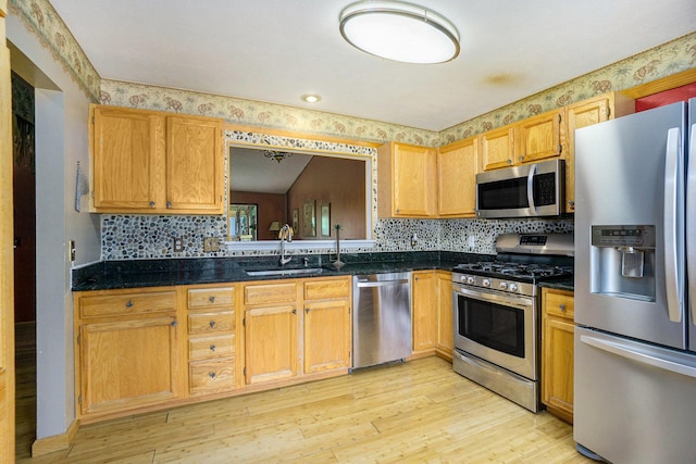 1721 Quail Run Dr, Kalamazoo, MI 49009 - kitchen featuring appliances with stainless steel finishes, light wood-type flooring, and decorative backsplash