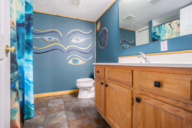1721 Quail Run Dr, Kalamazoo, MI 49009 - bathroom featuring vanity, a textured ceiling, stone finish flooring, and curtained shower