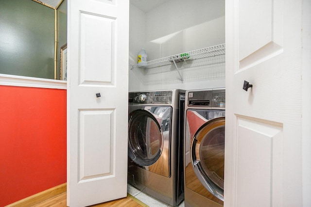 1721 Quail Run Dr, Kalamazoo, MI 49009 - laundry room with washer and dryer and wood finished floors