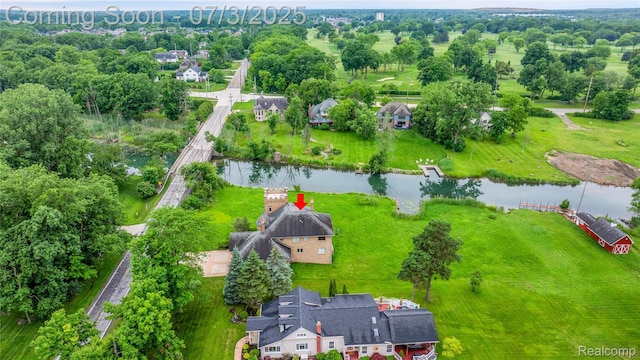 9000 Ferry Rd, Grosse Ile, MI 48138 - drone / aerial view of a nearby body of water and a tree filled landscape